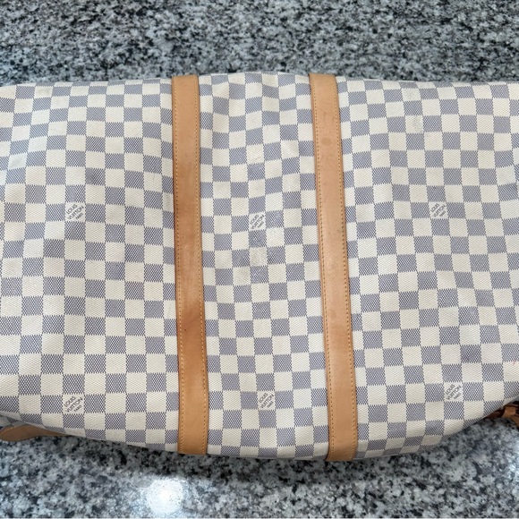 Louis Vuitton duffle bag, two of the straps are damaged as shown in pictures. - Picture 10 of 15